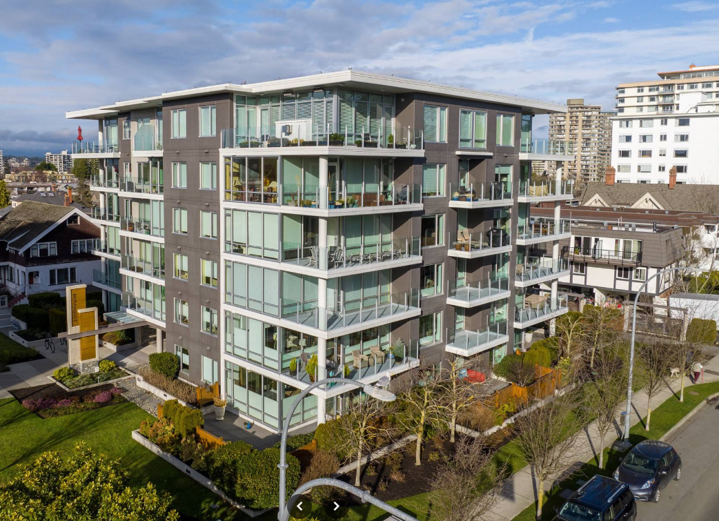 Modern apartment building with balconies in an urban setting